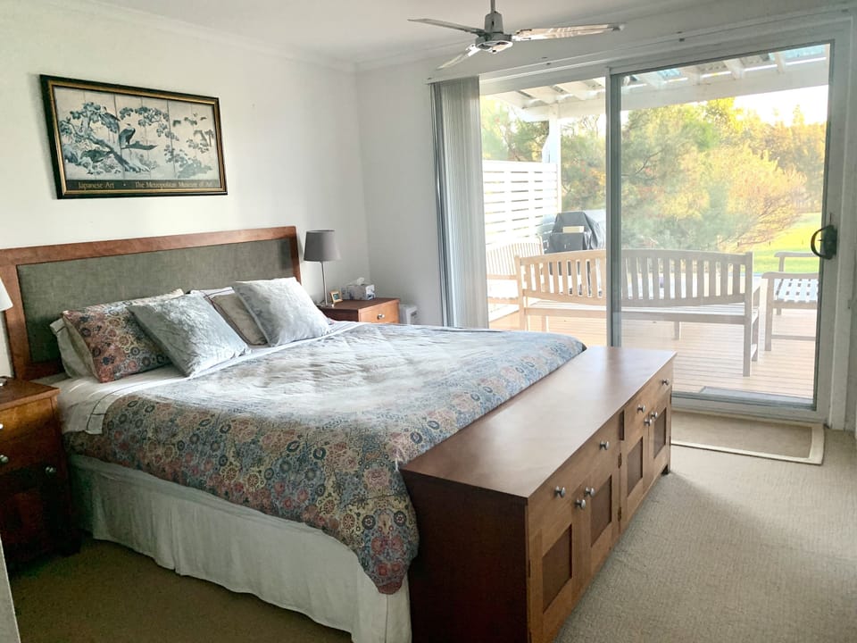 bedroom with king bed and ensuite bathroom