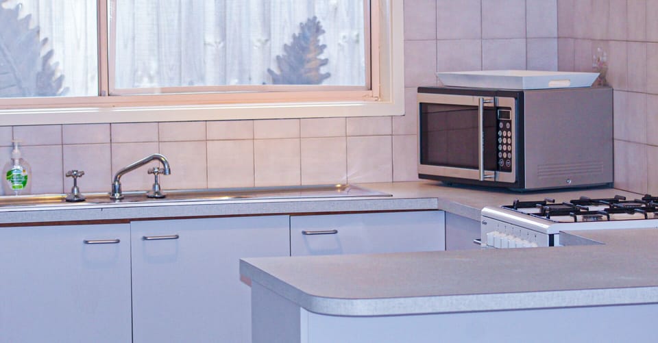 A fully kitted out kitchen - complete with dishwasher and full oven.