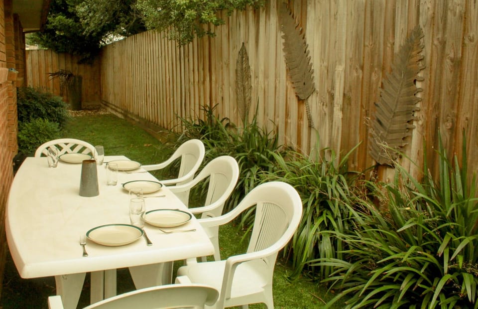 Relax in a the quiet and secure backyard.