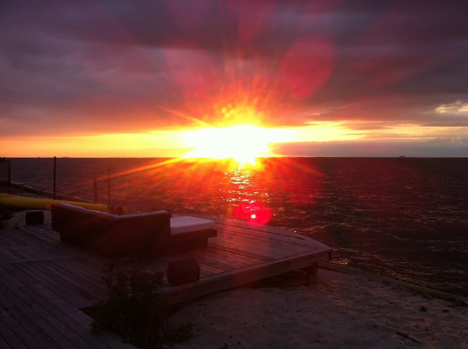 WATCH THE SUNSET FROM THE OUTDOOR SECTIONAL SOFAS ON THE WATER'S EDGE