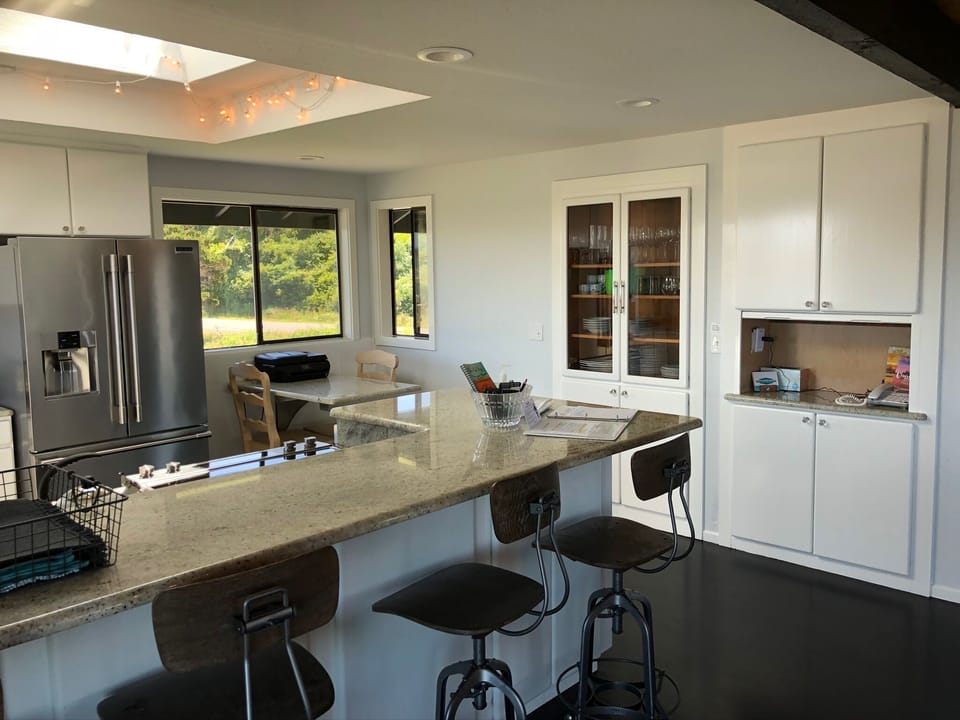 Kitchen with snack bar which seats 4