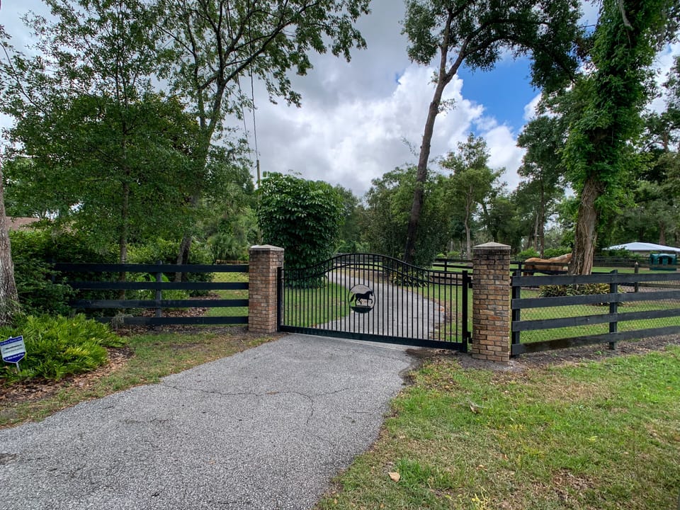 Enter through front gate on right