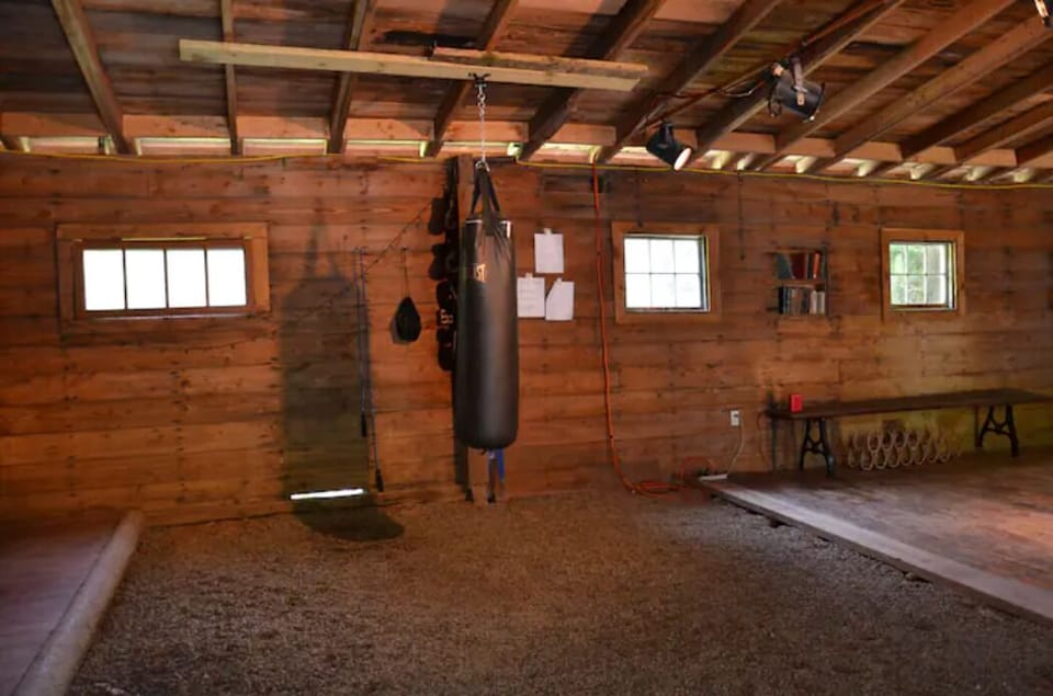 Boxing heavy bag in barn