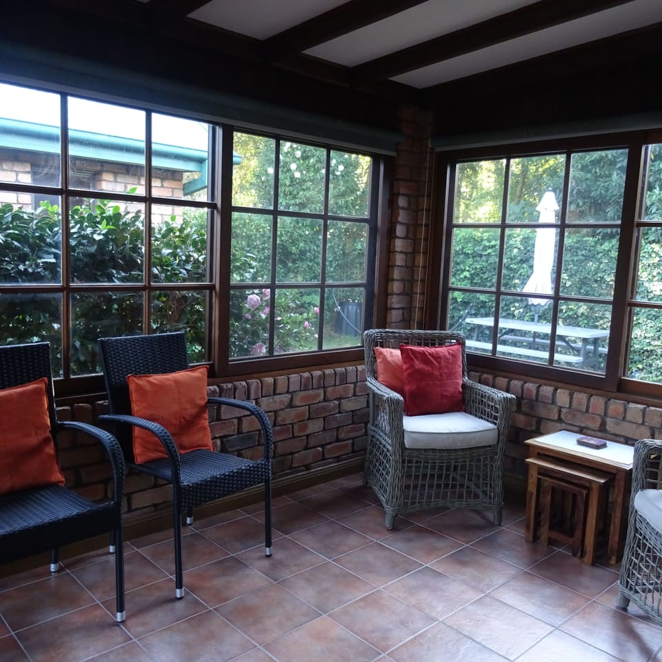 Sunroom - Light filled room looks out to backyard.