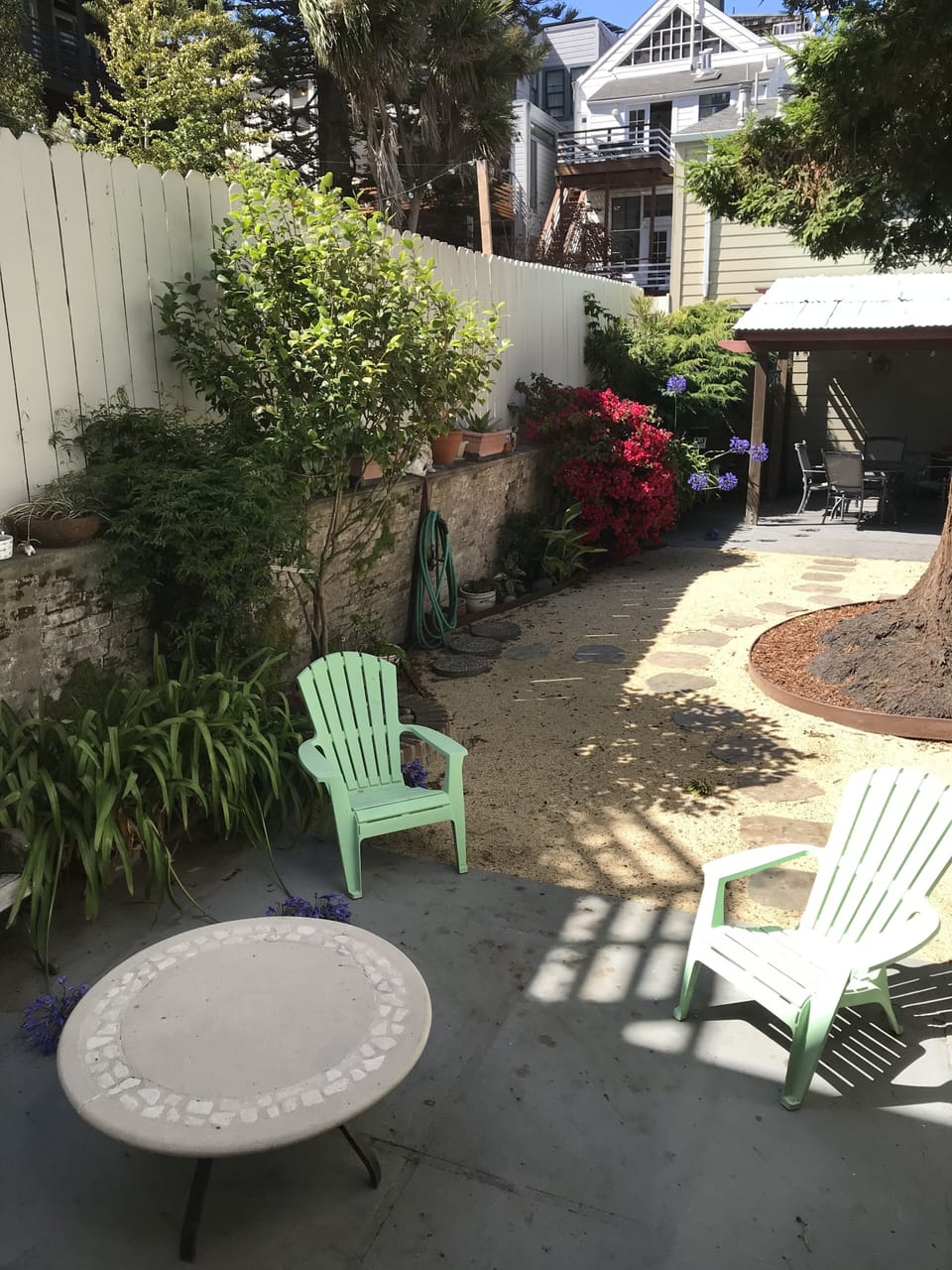  Garden has a large redwood tree which attracts birds and squirrels.