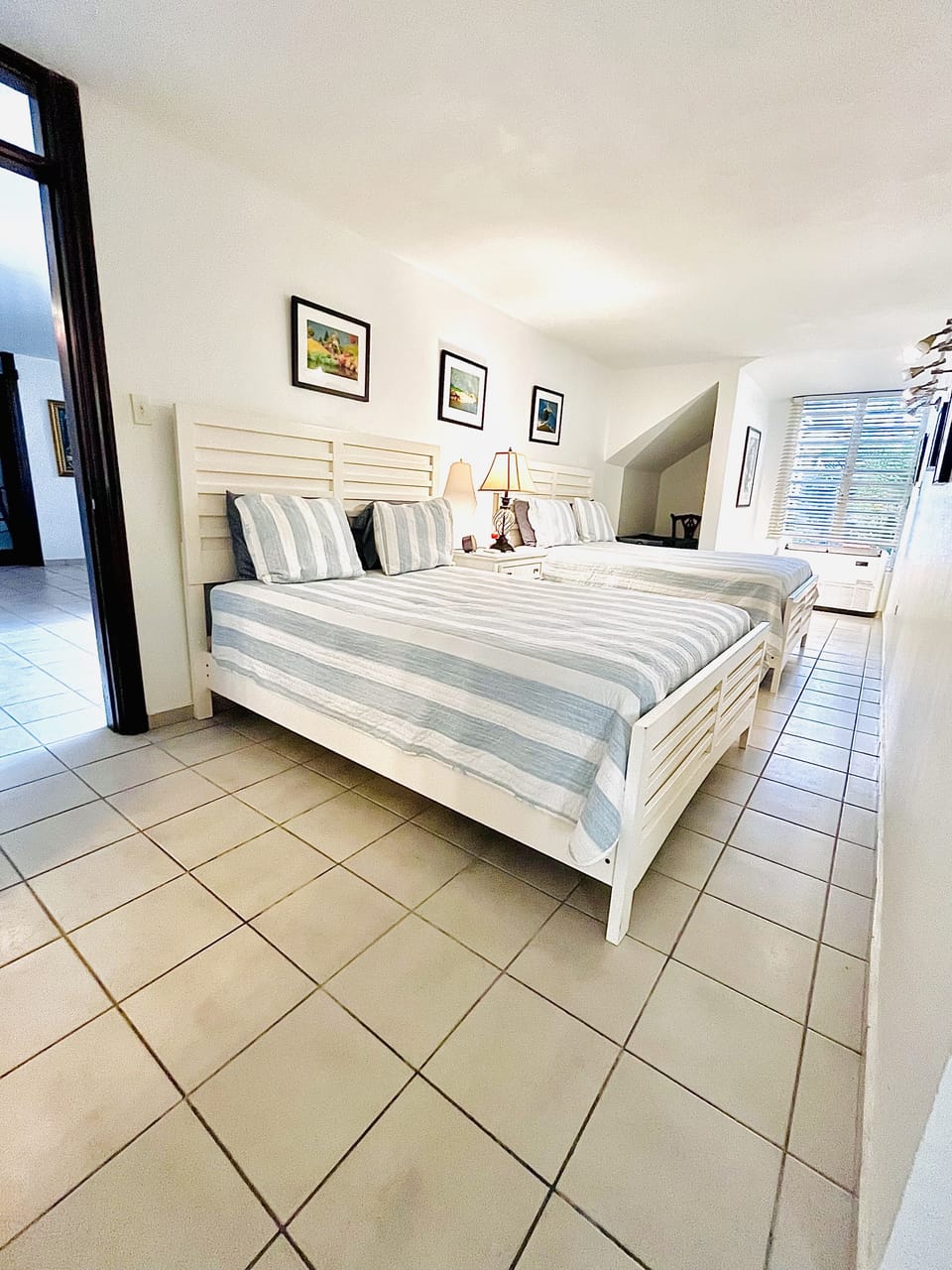 First bedroom on first floor with two queen beds 