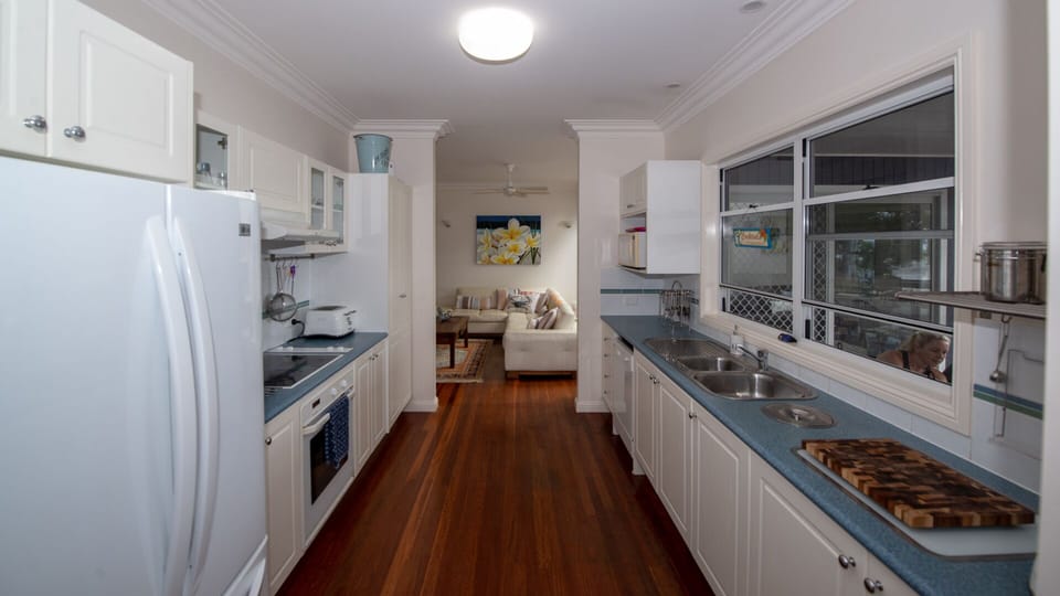 Breezy galley kitchen in the centre of the home