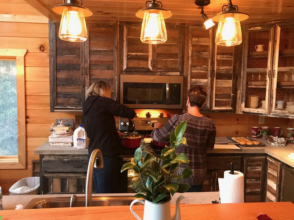 Handcrafted local Barn wood cabinets, country concrete counter tops and island! 