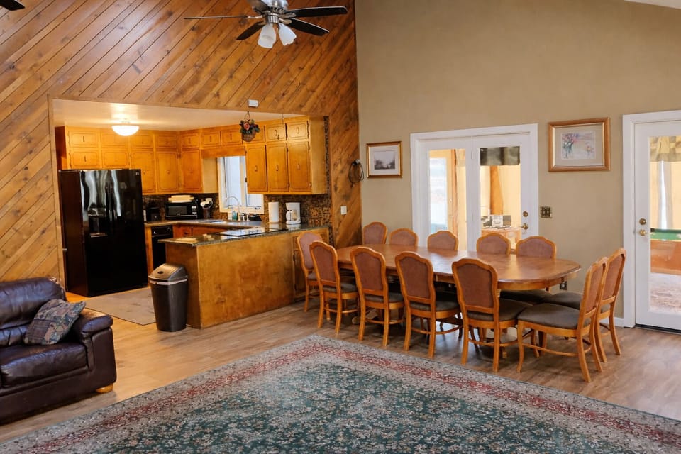 Kitchen and dining area and very large living for activities, sunroom with pool
