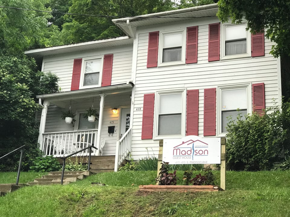 A view of the front of the Madison Guest House & the steps to the front porch