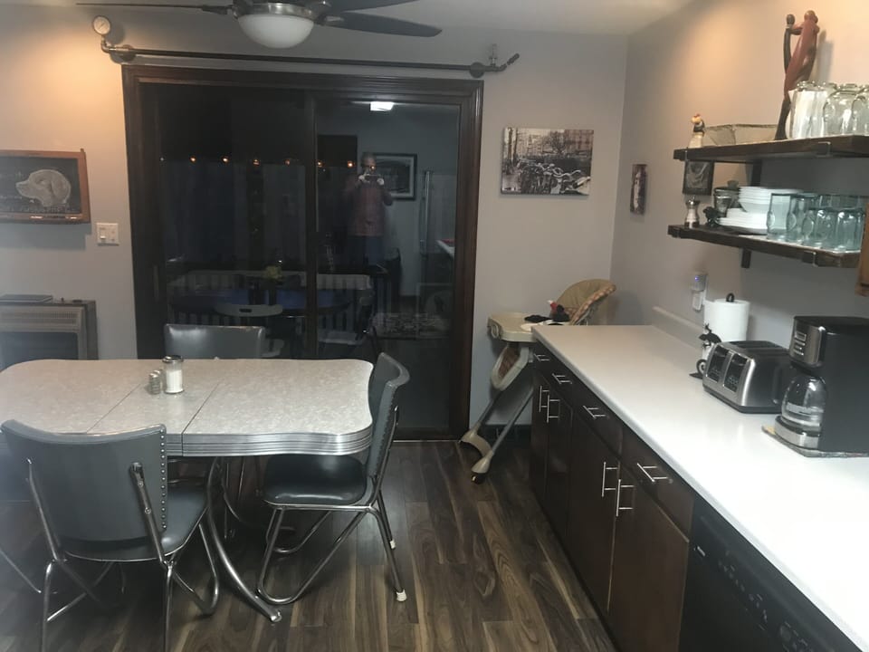 Kitchen with door to screened in porch. 