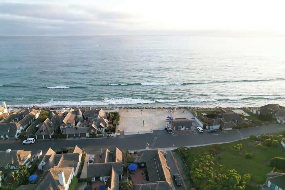 The community beach cabana + volleyball court from above!