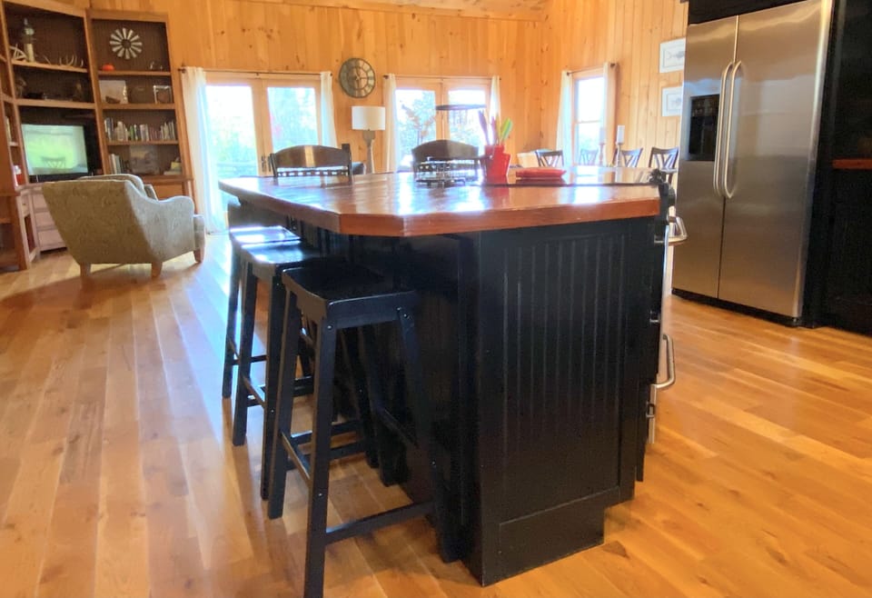 View of large kitchen island from front door.
