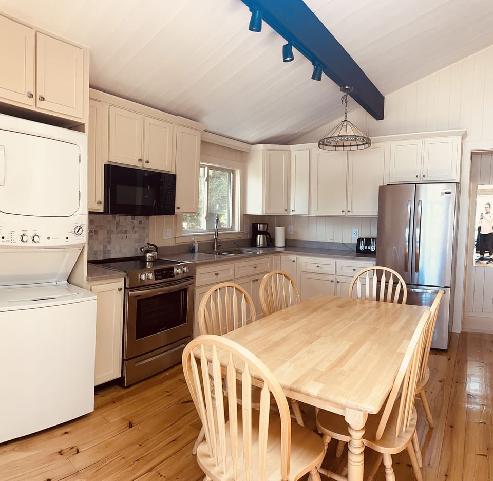 Newly renovated kitchen with custom cabinets and quarts countertop.  