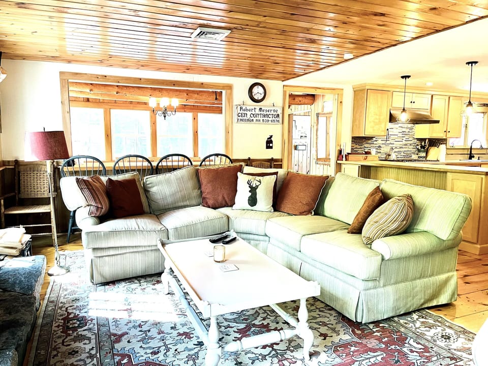 Living room with huge fireplace & river view 
