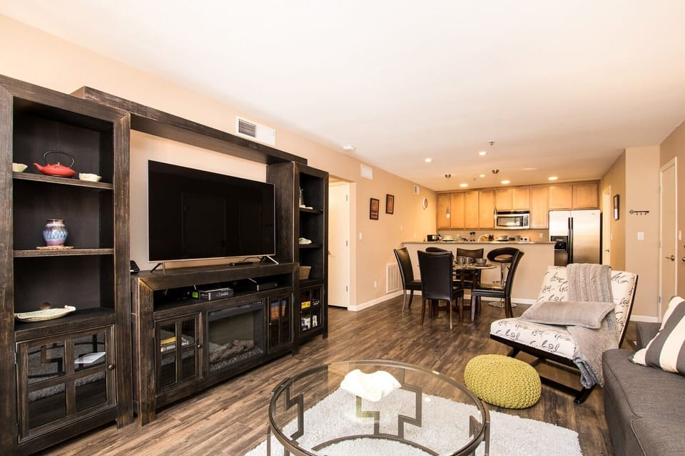 Electric fireplace and either glow for ambiance or emit heat for extra coziness.