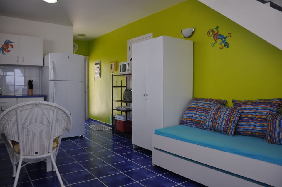 View of Kitchen and Twin Bed on Main Level of 8A