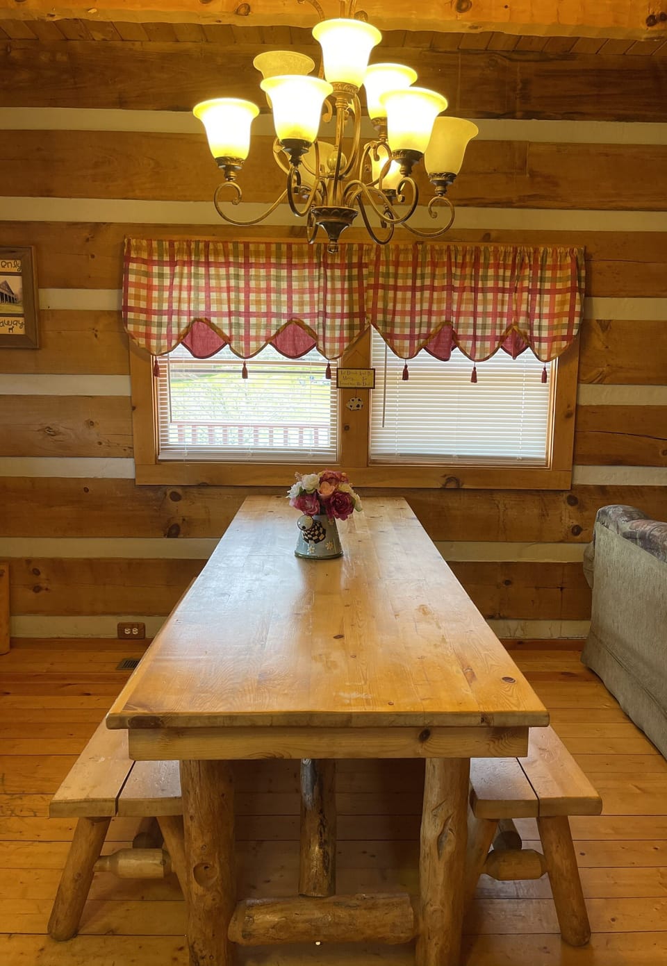 Large log dinning table. Open floor plan to kitchen and living room 