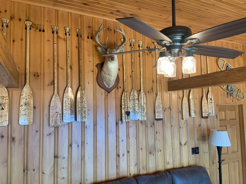 Canoe paddles signed by all our past renters!