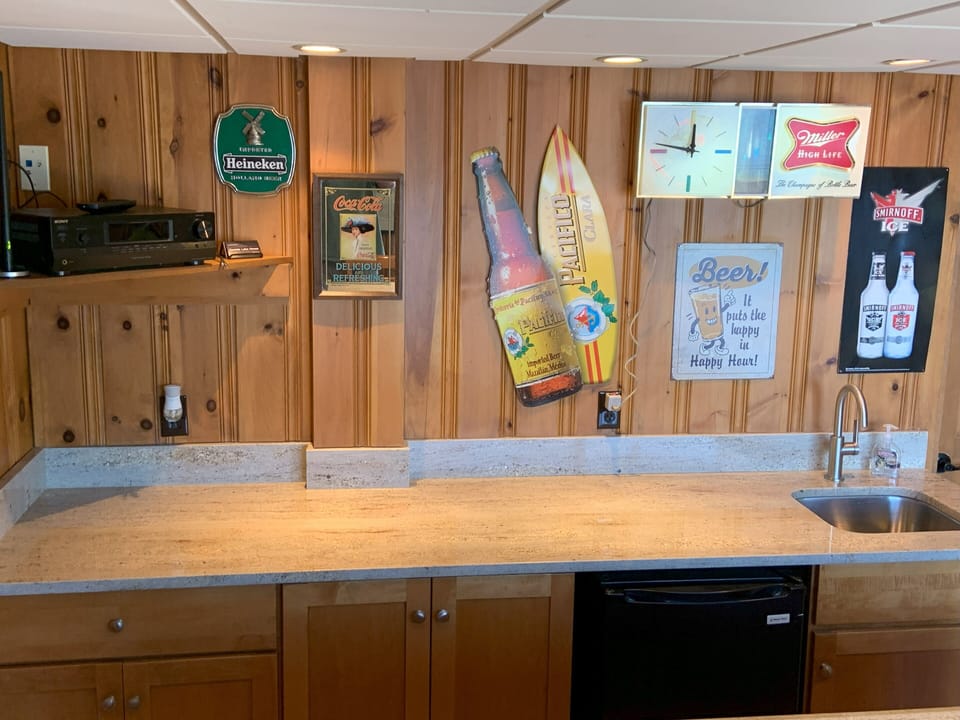 Sink and refrigerator in the bar room.