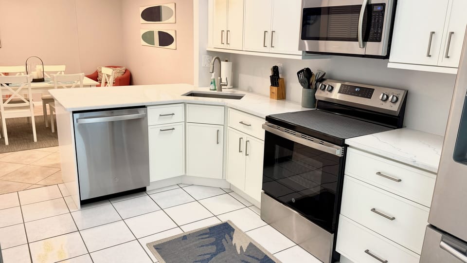 Newly remodeled kitchen with new cabinets, quartz countertops and appliances.