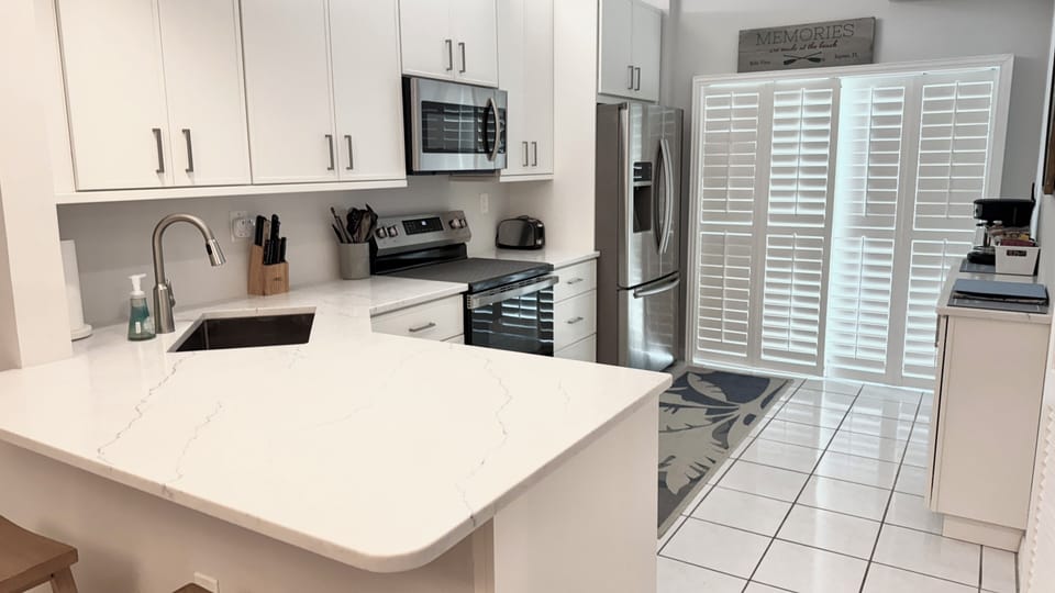 Newly remodeled kitchen with new cabinets, quartz countertops and appliances.
