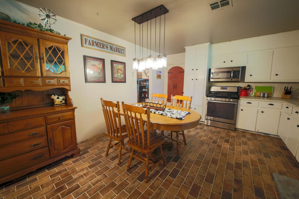 Kitchen.  Table displays four chairs but has six total.