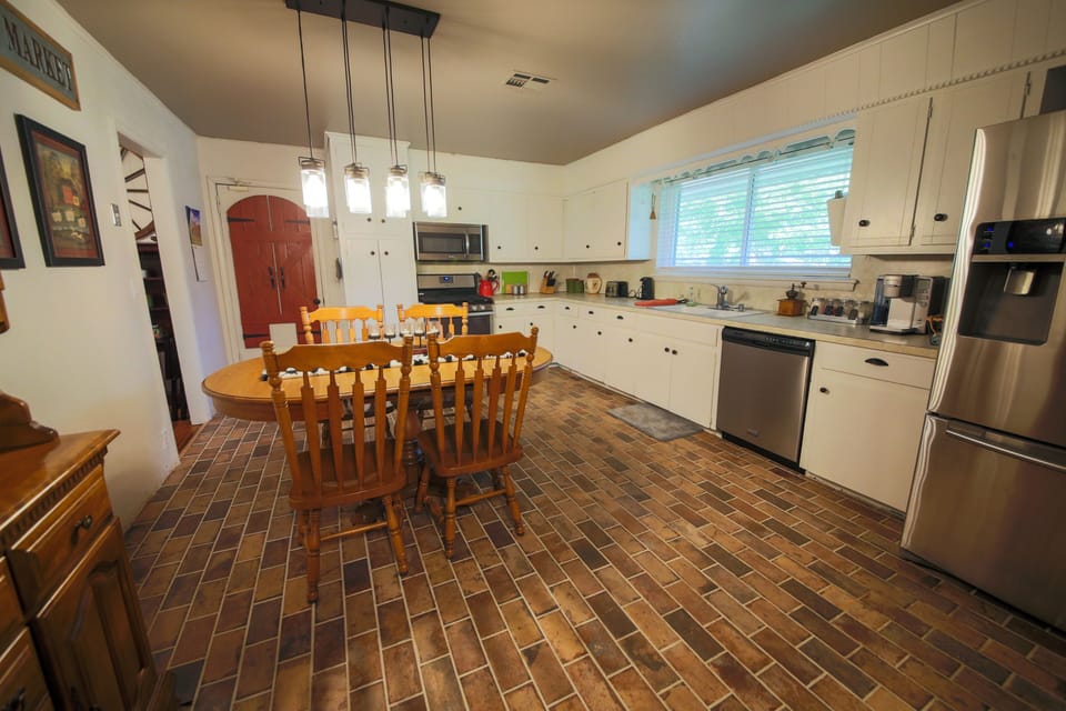 Kitchen with Gas Stove, Gas Oven, Microwave, Dishwasher and Refrigerator