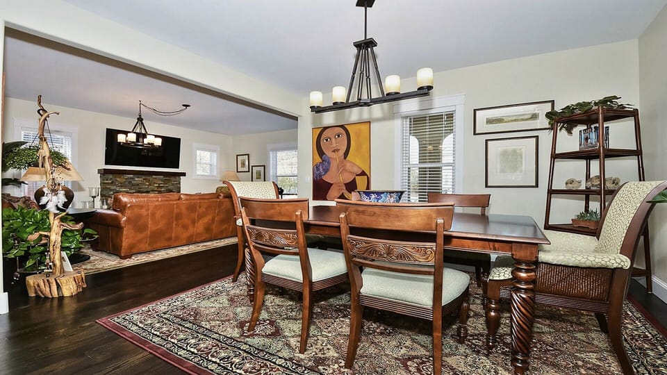 Dining room with wooden table and oversized chairs