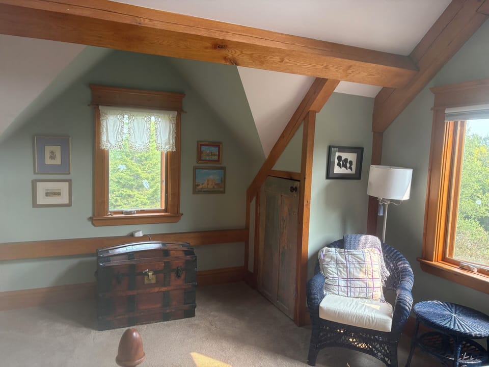 View of seating area and trunk in MBR.  This sunny room overlooks the valley.