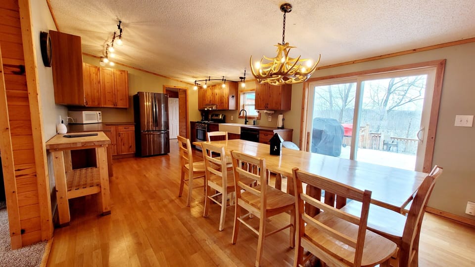 A well stocked kitchen with easy access the spacious deck.