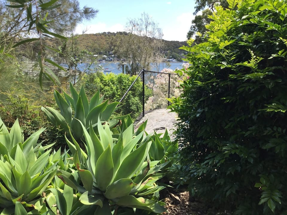 High cyclone fence surrounds entire property.