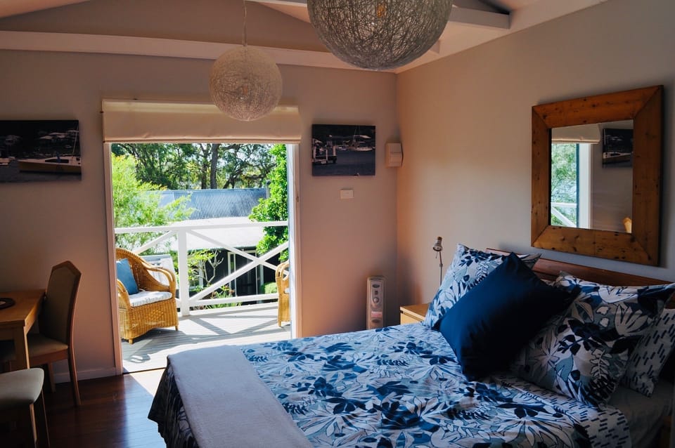 Studio or motel style room with sunny deck. 
Cottage Lodge in background.