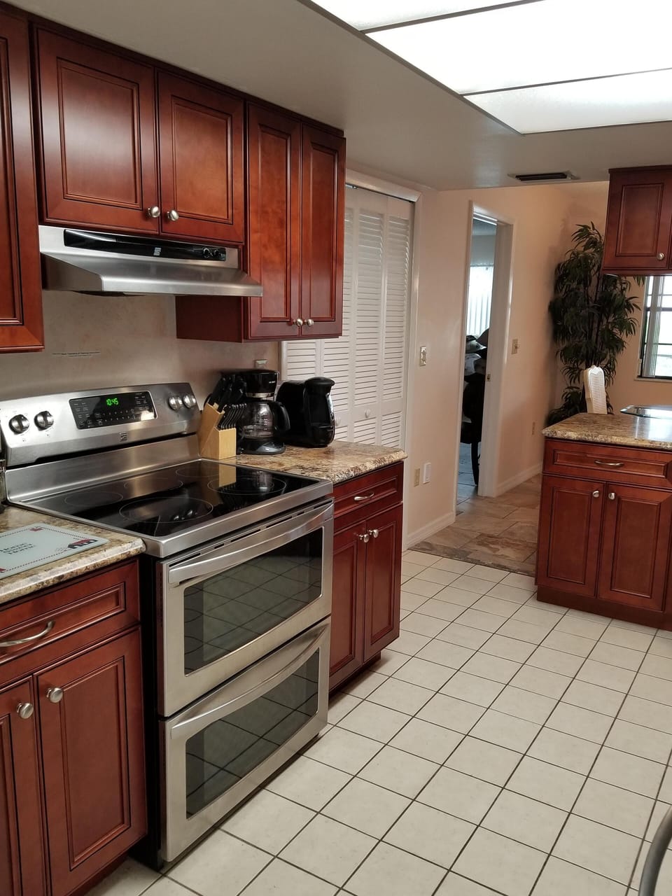 View of stove/oven & pantry in Kitchen. 