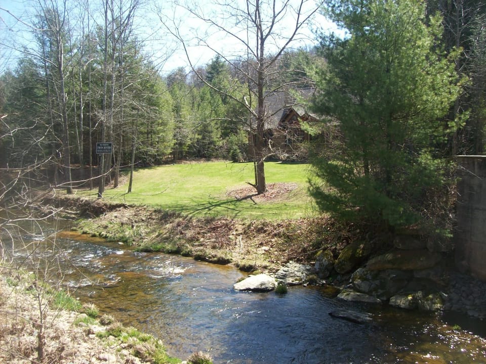 Rear of home with convenient and safe river access