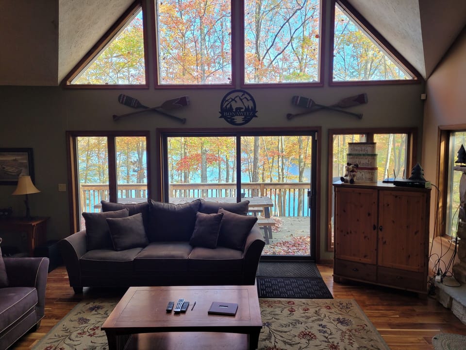 Family room view looking out onto the porch and the lake beyond