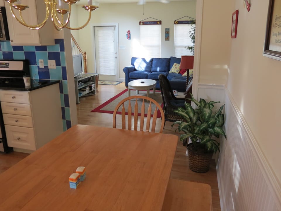 Dining area / kitchen in foreground, living room in background