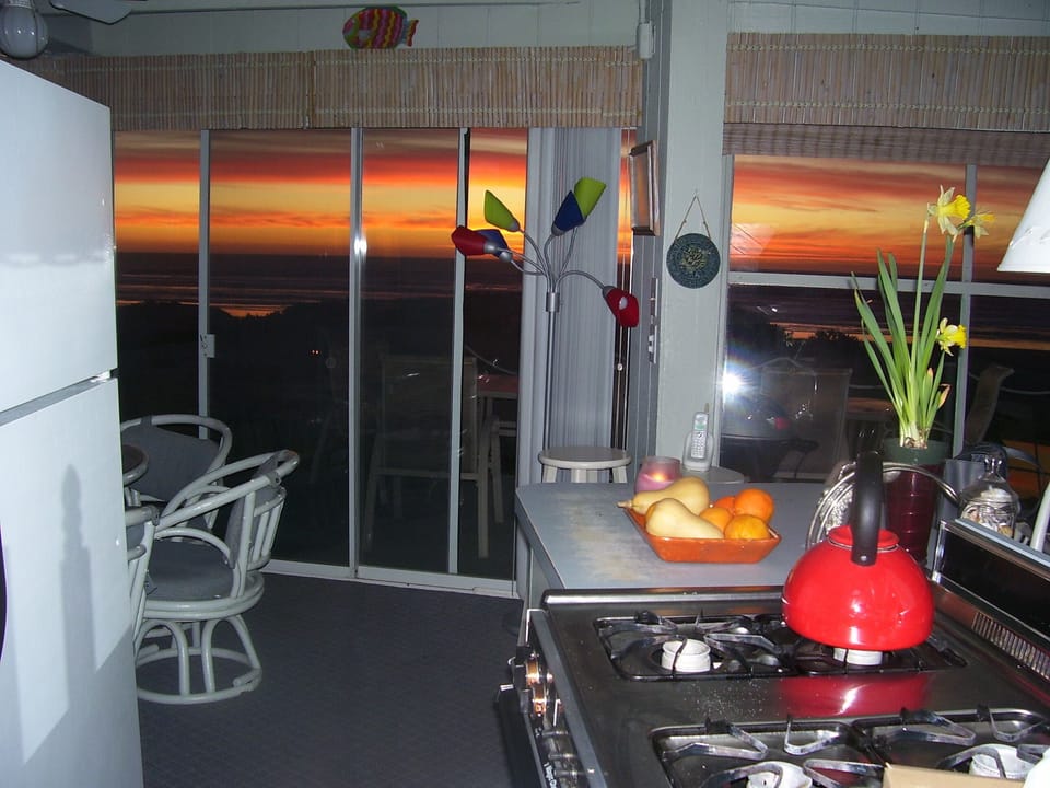 Kitchen at sunset, no dishwasher and small, but what a view