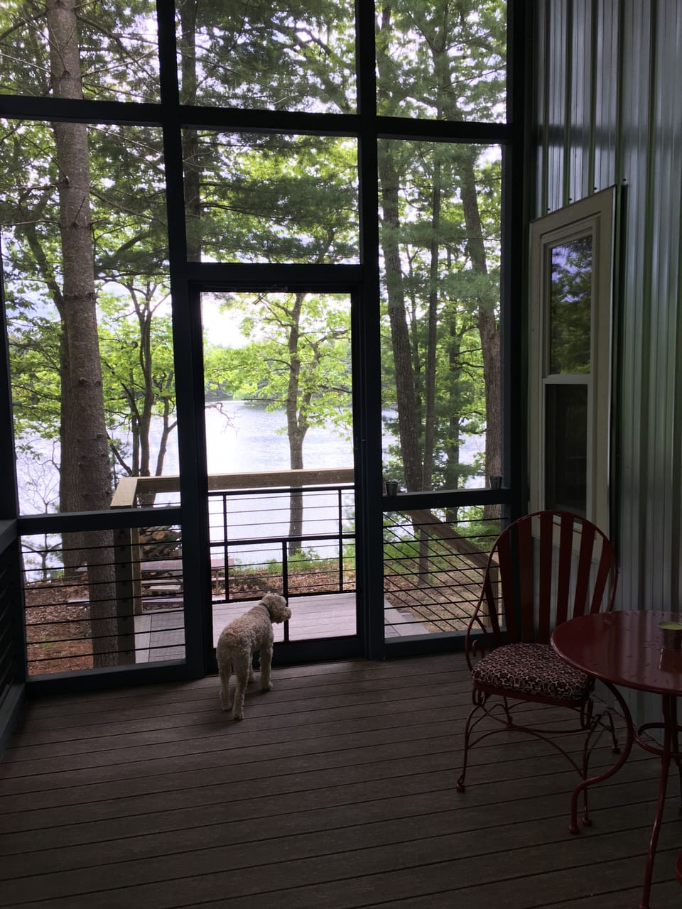 Screen porch off of living room side of great room.  View of lake.