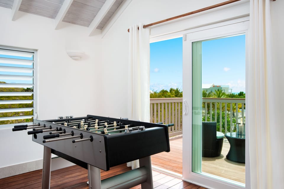 Second floor game nook sports a foosball table with ocean views!