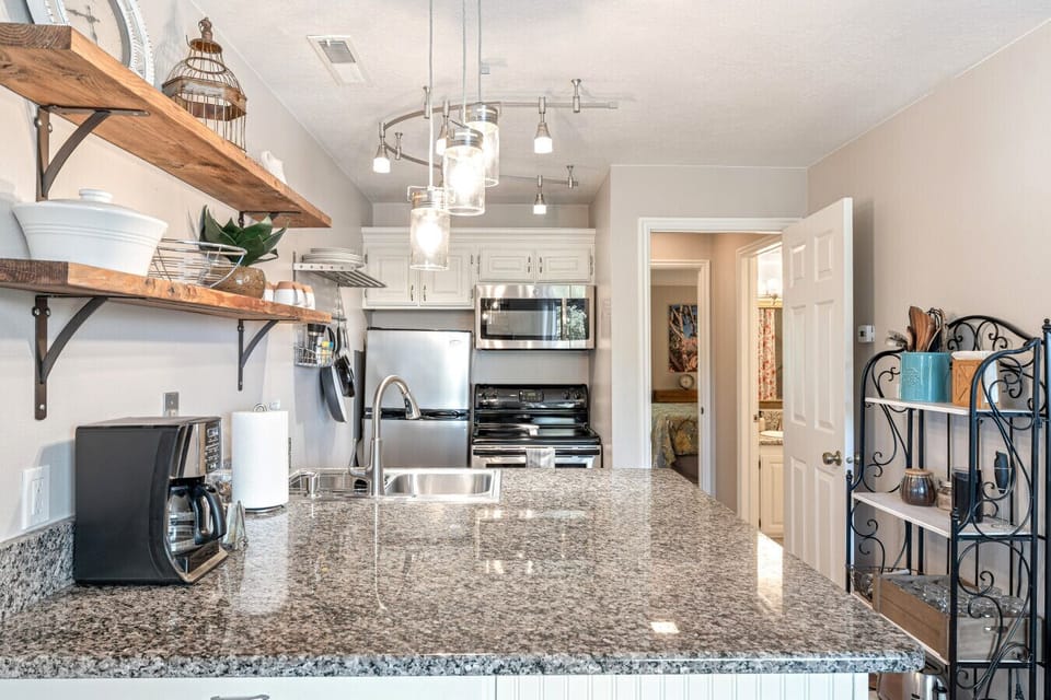 View of the kitchen with the extra privacy door leading to bathroom and bedroom