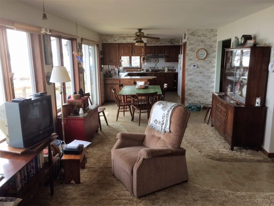 Living room and kitchen all with views of Owasco Lake.