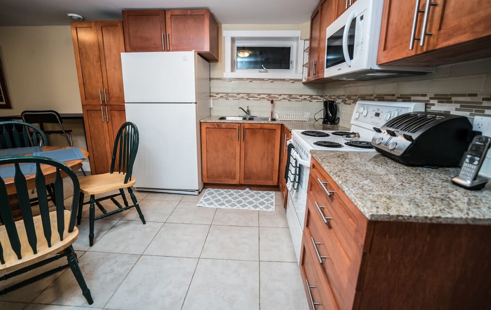 Lower Kitchen, custom cabinetry and granite counters