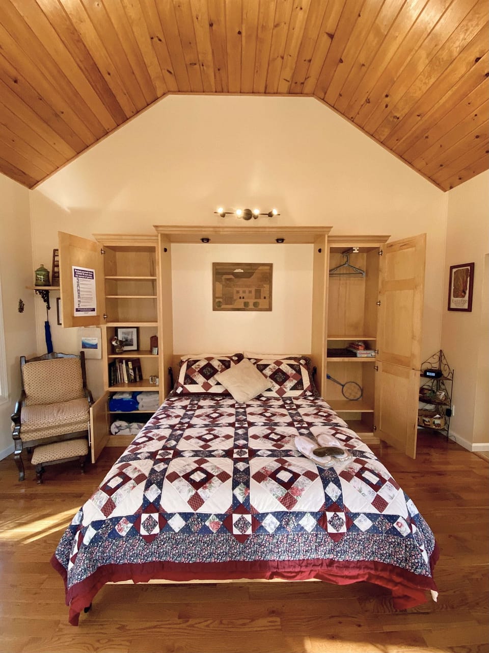 Queen-sized Murphy Bed offers storage.