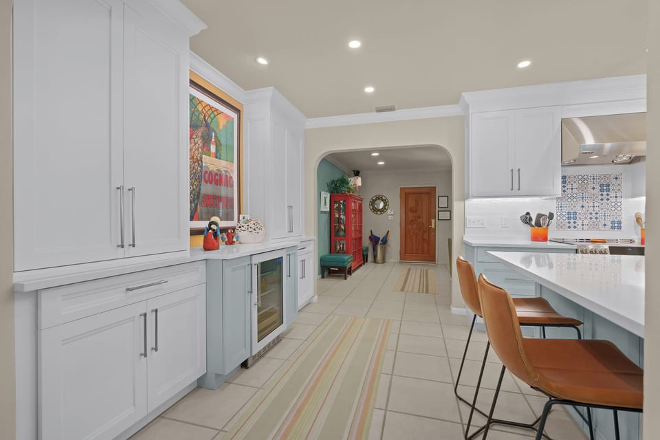 Kitchen with ample barware and beverage refrigerator