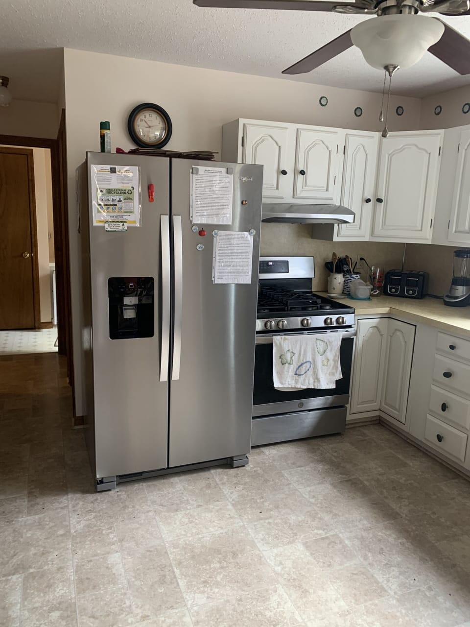 Spacious kitchen with new refrigerator and gas stove. 