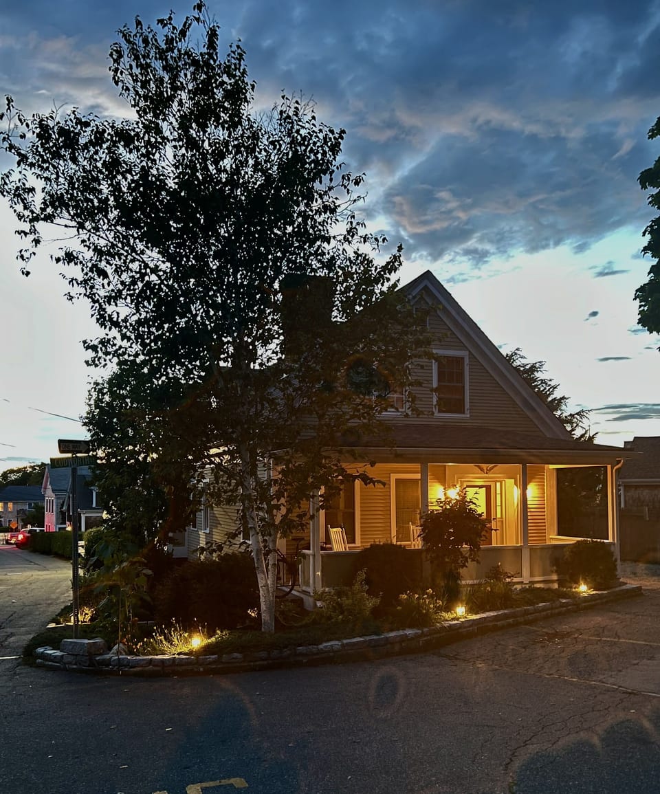 Unit at Dusk: Featuring a view of the private covered porch.