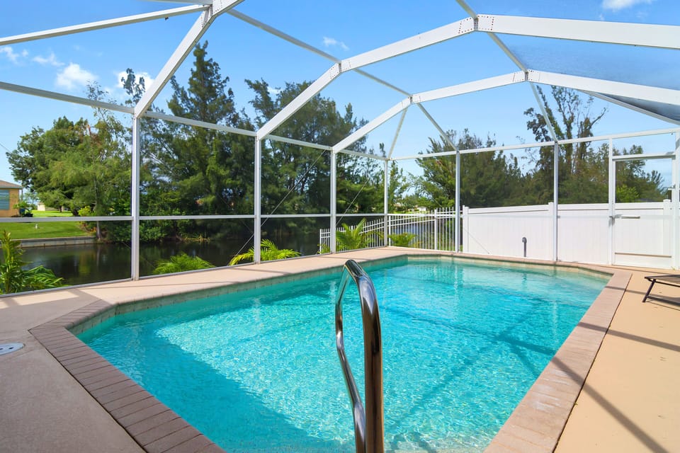 Private heated pool overlooking the water.