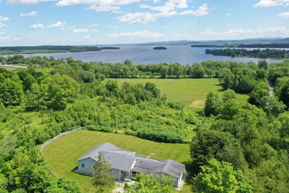 Discreetly situated with seemingly endless meadow, mountain, and water views.
