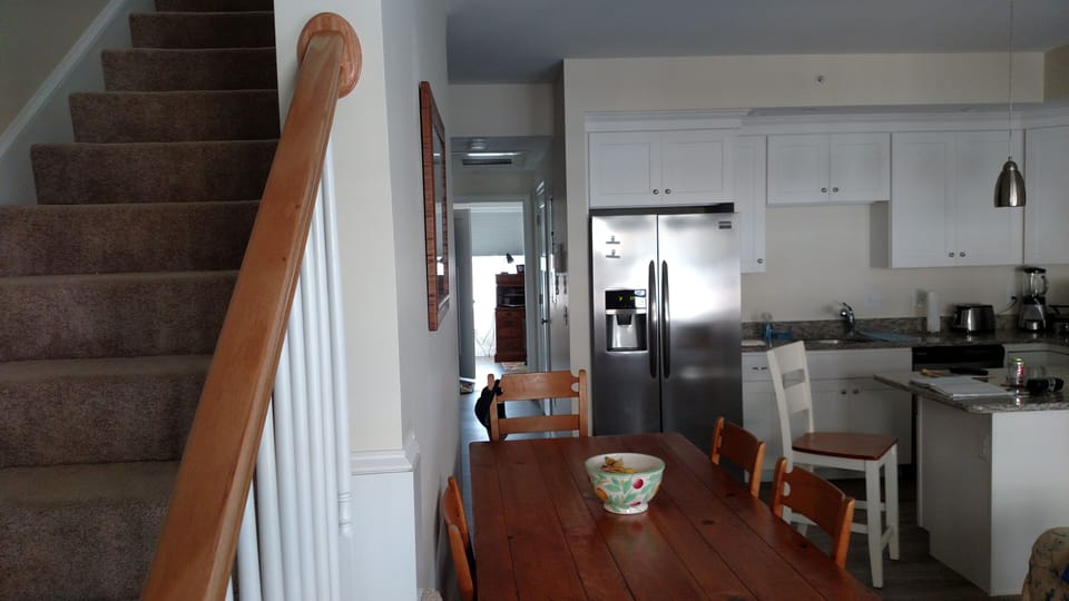 view of stairs kitchen family room